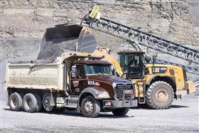 Rahns Concrete: A Rahns Trucking Mack tri-axle is loaded with stone for delivery. 