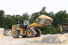 Rahns Concrete: A Caterpillar 966M loads concrete sand into a hopper at a Rahns Concrete ready-mix plant. 