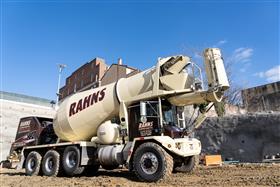Rahns Concrete: A Rahns Concrete McNeilus front discharge concrete mixer delivery concrete to a site.  