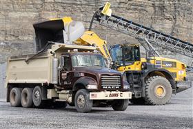 Rahns Concrete: A Rahns Trucking Mack tri-axle is loaded with stone for delivery. 